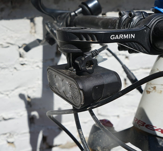 Gloworm CX Core Light System mounted on Dilara Tuna's handlebar during the 2025 Trans Balkan Race.